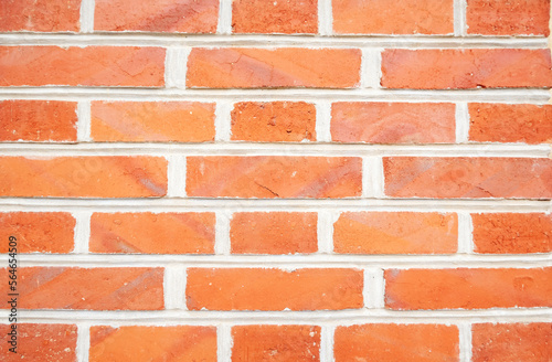 Red brick old wall, textured horizontal background, selective focus