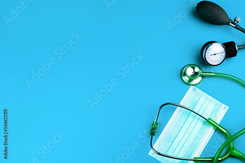 stethoscope and mask for a doctor with blue background