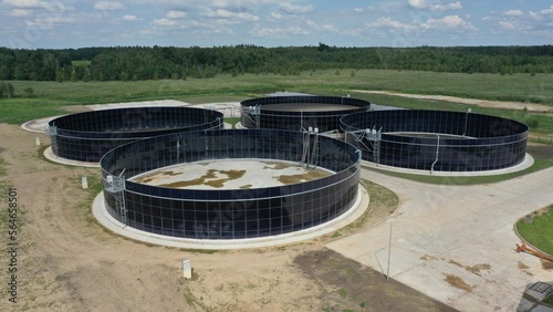 Obraz na plátně Large round metal tanks for storing liquid waste from an agricultural farm