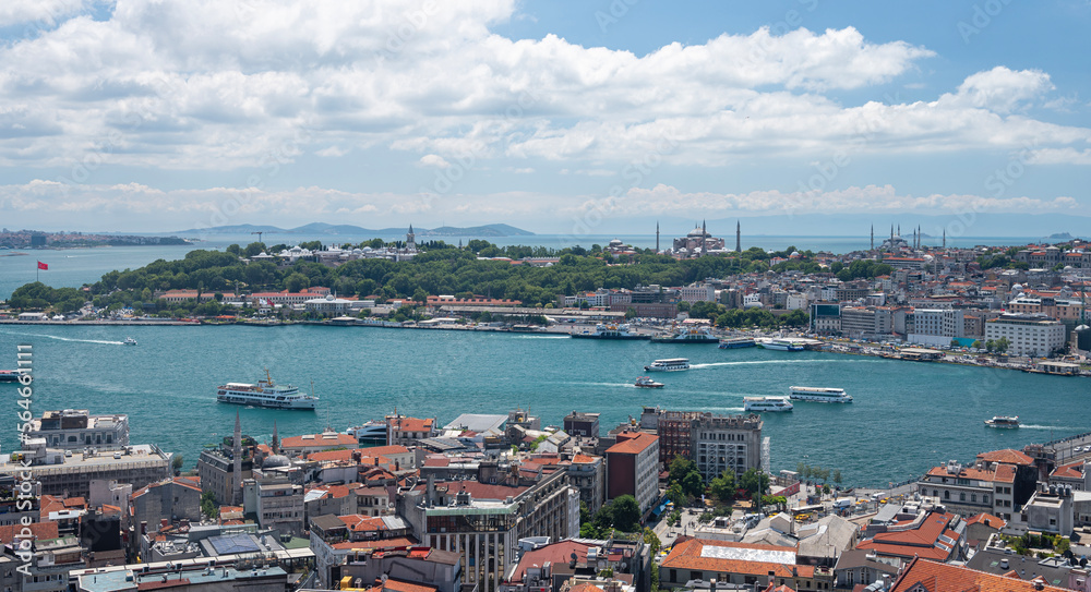 View from the roof of the Bosphorus Strait with ships and a mosque. Summer panoramic landscape in Istanbul, Turkey