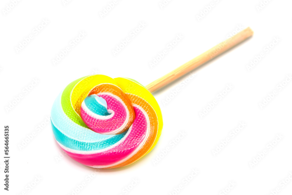 Colorful rainbow lollipop on wooden stick isolated on white background. Colorful rainbow lollipop on wooden stick isolated on white background.