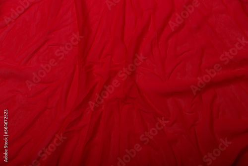Texture of red cotton fabric, background or backdrop. Clothing, sewing, gressmaking, haberdashery. Copy space.
