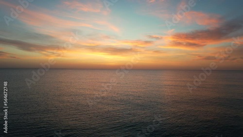 Picturesque sunrise over calm smooth waters of Mediterranean Sea. Sunny morning glow. Travel and tourism concept