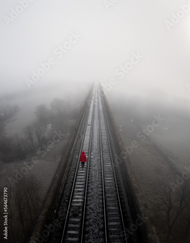 Εκτύπωση καμβά Aerial landscape of a lost hopeless person on a railway line in a depression con