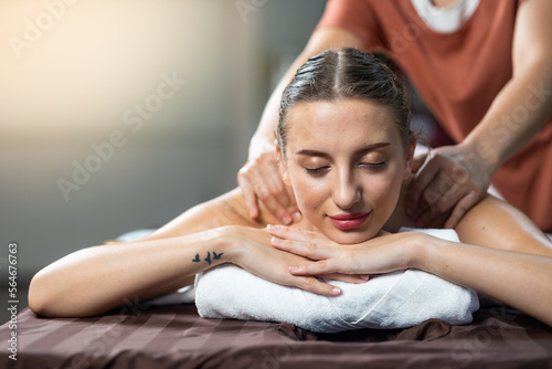 Back spa massage. Beautiful cuacasian female getting massage in beauty spa and wellness center. Facial treatment and skin care concept.
