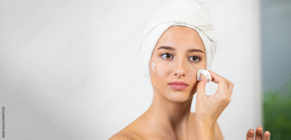 women's daily routine. Beautiful caucasian young woman removing makeup and cleaning from her face isolated on white background women's daily routine. Beautiful caucasian young woman removing makeup and cleaning from her face isolated on white background