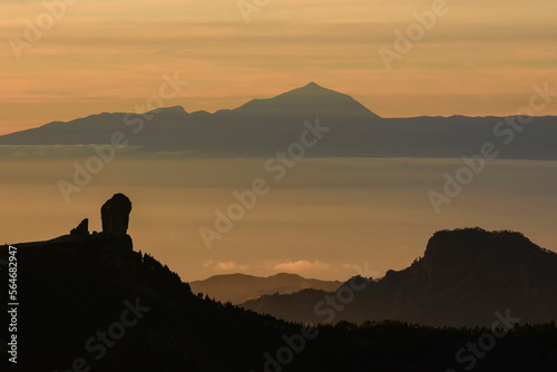 Magic view of Roque Nublo and the magestic Teide peak on the island of Tenerife in the background at sunset  Roque Nublo Rural Park  Gran Canary  Canary Islands  Spain