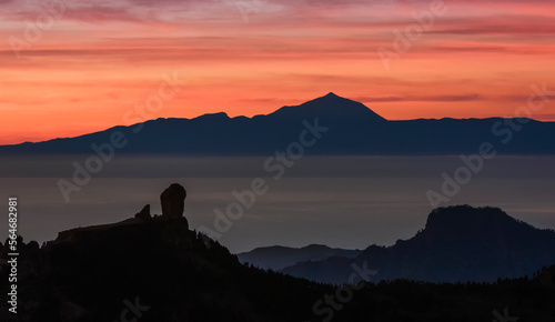 Magic view of Roque Nublo and the magestic Teide peak on the island of Tenerife in the background at sunset  Roque Nublo Rural Park  Gran Canary  Canary Islands  Spain