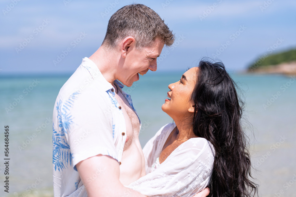 Love couple on holiday happy playing running along the beach and sweet kiss on love emotion Love couple on holiday happy playing running along the beach and sweet kiss on love emotion
