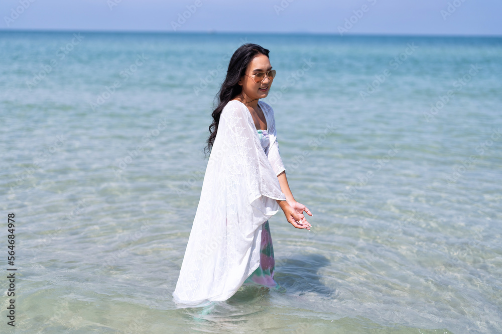 Women on holiday traveling to beach have fun enjoy and throwing sea water to love couple Women on holiday traveling to beach have fun enjoy and throwing sea water to love couple