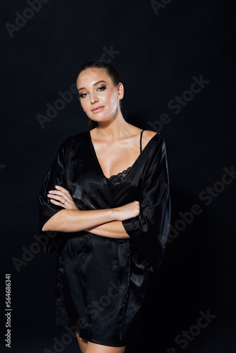 beautiful woman standing in black underwear at night