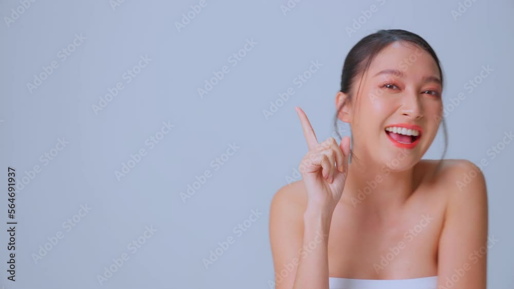 Close up beauty shot of beautiful asian woman looking at camera isolated on black Gray background. Perfect facial beauty skin smiling. Female with beauty, healthy, fashion, skin treatment concept. Close up beauty shot of beautiful asian woman looking at camera isolated on black Gray background. Perfect facial beauty skin smiling. Female with beauty, healthy, fashion, skin treatment concept.