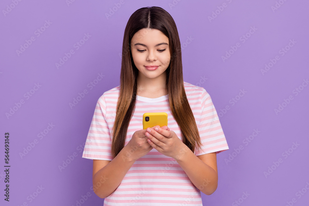 Photo of cute pretty young lady wear striped white t-shirt reading message modern gadget isolated violet color background