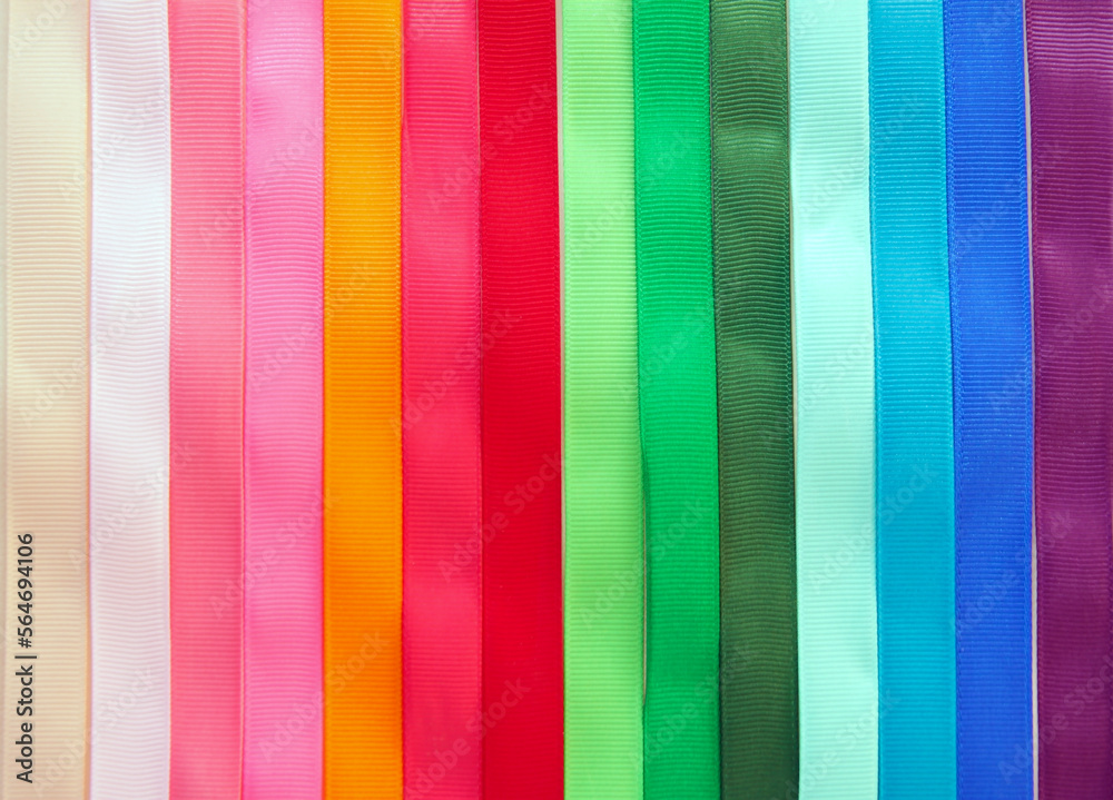 Set of colored textile ribbons. Multicolored satin ribbons, colorful serpentine design element.