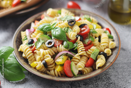 A bowl with traditional Italian pasta salad