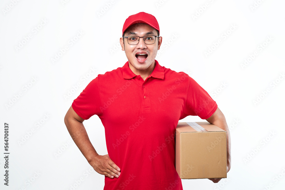 Cheerful asian man in red cap and t-shirt, holding parcel box. Courier pick-up package from client Cheerful asian man in red cap and t-shirt, holding parcel box. Courier pick-up package from client