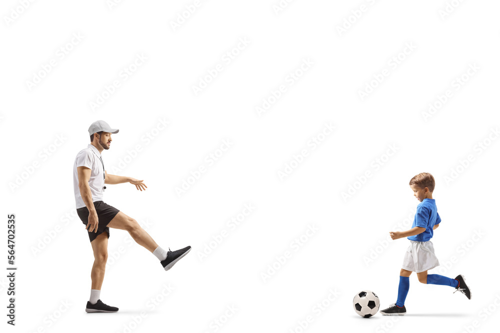Coach playing football with a boy