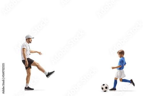 Coach playing football with a boy