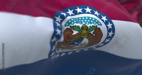 The US state flag of Missouri waving in the wind photo