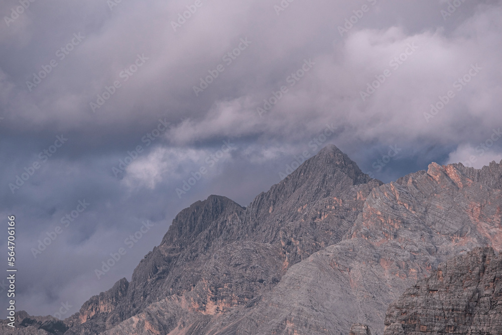 Dolomite mountain under a cloudy sky at dusk Dolomite mountain under a cloudy sky at dusk