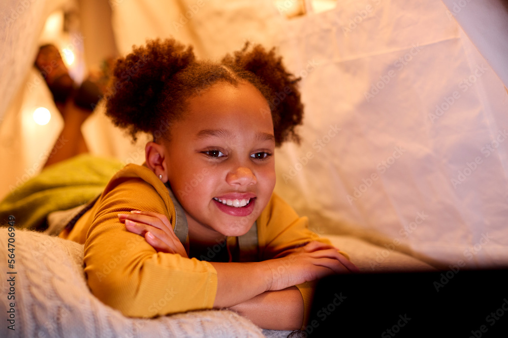Girl At Home Lying In Indoor Tent Or Camp Watching Or Streaming To Digital Tablet Girl At Home Lying In Indoor Tent Or Camp Watching Or Streaming To Digital Tablet