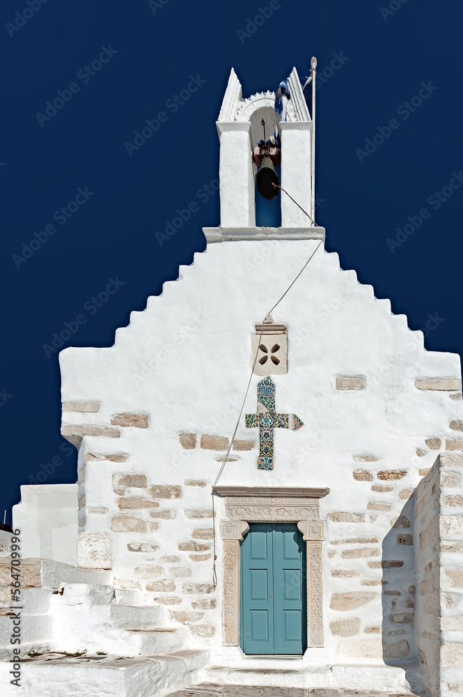 Agios Konstantinos Church with blue door and glaze cross at Parikia, Paros. Greece