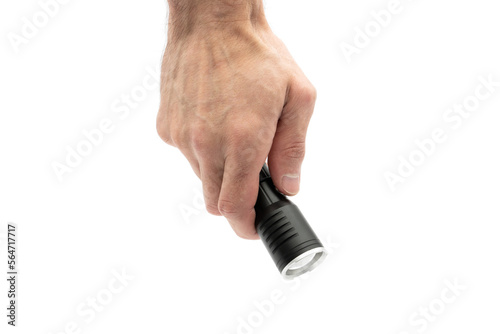 Male hand holding a black metal flashlight, isolated on white