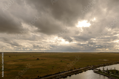 Canvas Print Aerial top view over Naturcenter Amager, Nature preserve area near near 8 House apartment in Copenhagen, Denmark during sunset