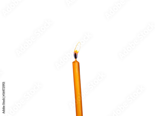 One ellow burning wax candle with flame up isolated