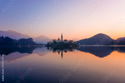 Dramatic winter sunrise on Lake Bled with the surrounding mountains