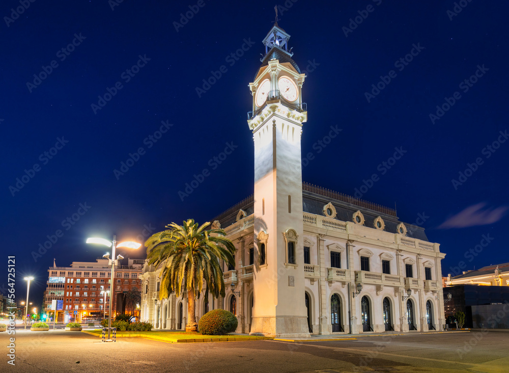 Night landscape of the Port of Valencia with the clock tower, Spain. - obrazy, fototapety, plakaty 