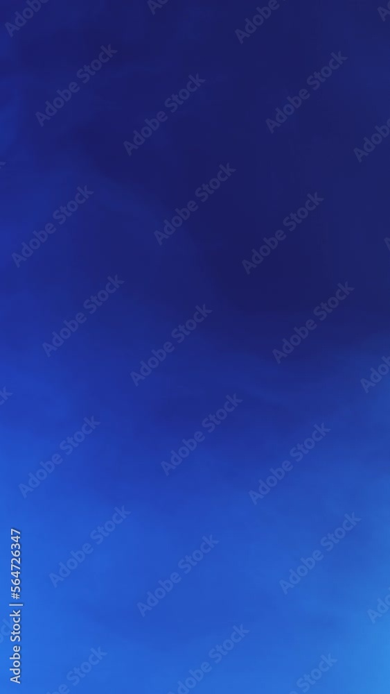 Vertical video. Defocused laser beam. Neon haze. Fluorescent rays. Blur blue color light glow smoke motion on dark abstract free space background. Vertical video. Defocused laser beam. Neon haze. Fluorescent rays. Blur blue color light glow smoke motion on dark abstract free space background.