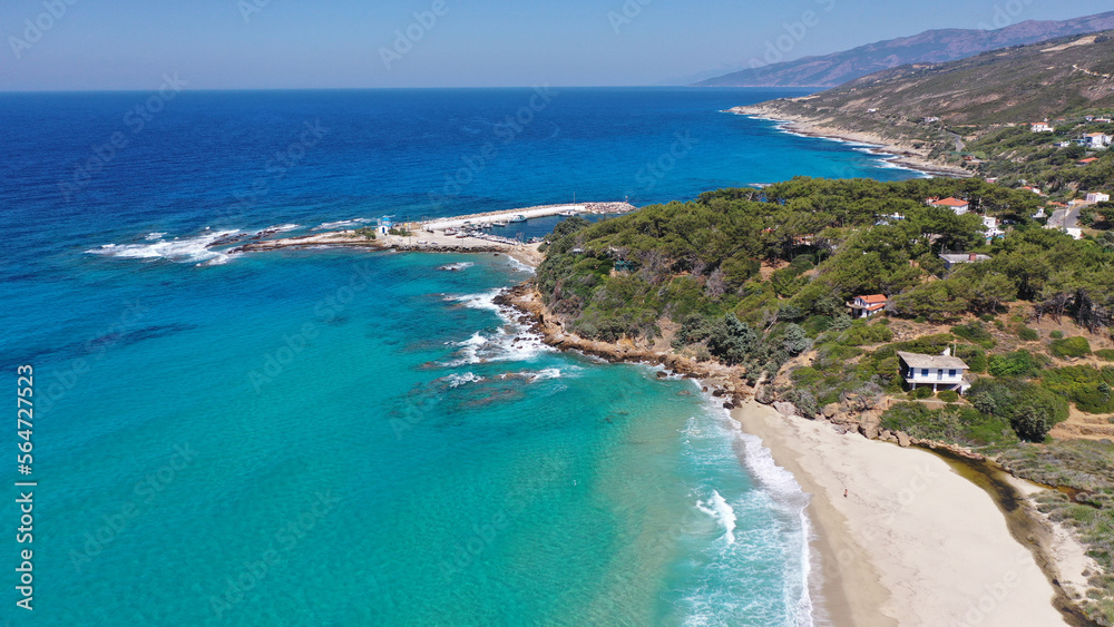 Aerial drone photo of famous wavy beach of Mesakti ideal for wind surfing in island of Ikaria, Aegean, Greece Aerial drone photo of famous wavy beach of Mesakti ideal for wind surfing in island of Ikaria, Aegean, Greece