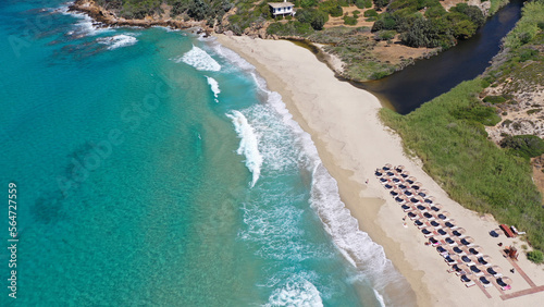 Aerial drone photo of famous wavy beach of Mesakti ideal for wind surfing in island of Ikaria, Aegean, Greece