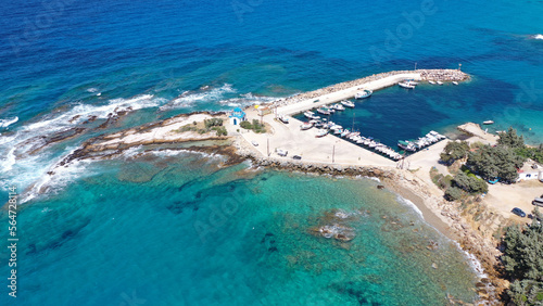 Aerial drone photo of picturesque small seaside church of Analipsi built in small port of Gialiskari, Ikaria island, Aegean, Greece