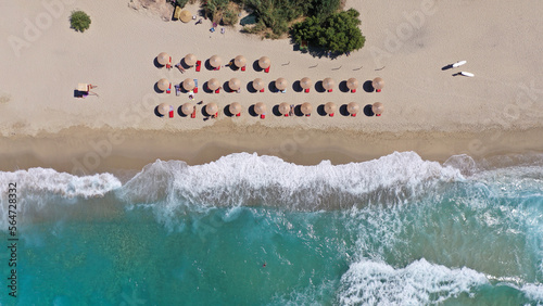 Aerial drone top down photo of paradise organised sandy beach with sea beds and umbrellas in tropical exotic destination island