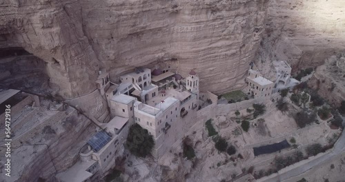 St. George Orthodox Monastery and Wadi Qelt in Judean desert. Monastery of St. George of Choziba, Israel. The sixth-century cliff-hanging complex photo