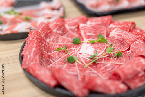 Slice of fresh raw beef at hot pot restaurant