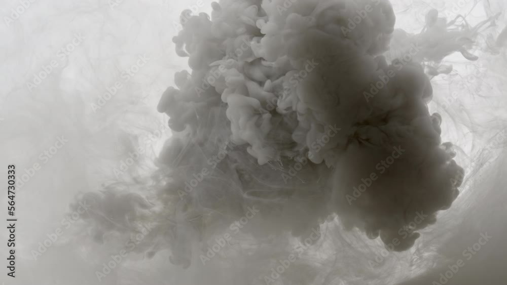 Macro shot of black and white inks are being injected in cloudy water from two different corners mixing into grey one on white background | Background shot for skin care cosmetics commercial Macro shot of black and white inks are being injected in cloudy water from two different corners mixing into grey one on white background | Background shot for skin care cosmetics commercial