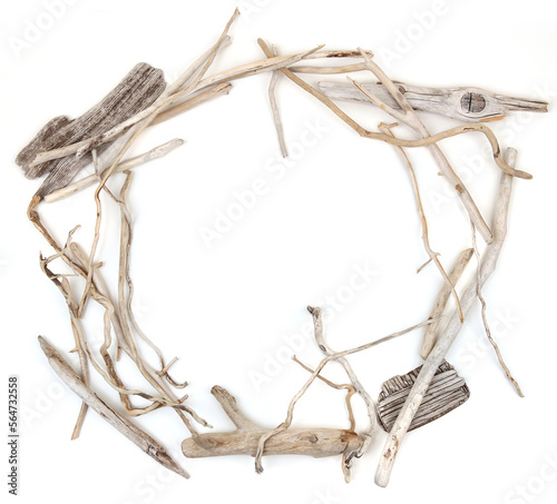 Circle of sea driftwood branches isolated on white background. Bleached dry aged drift wood.