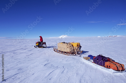 Shaun Norman snowmobiles across the Polar Plateau not far from the South Pole, Antarctica, during an expedition to collect meteo