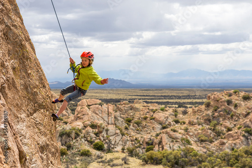 Girl rock climbing in Cochise Stronghold, Tombstone, Arizona, USA photo