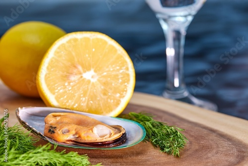 mussels open on a wooden platter