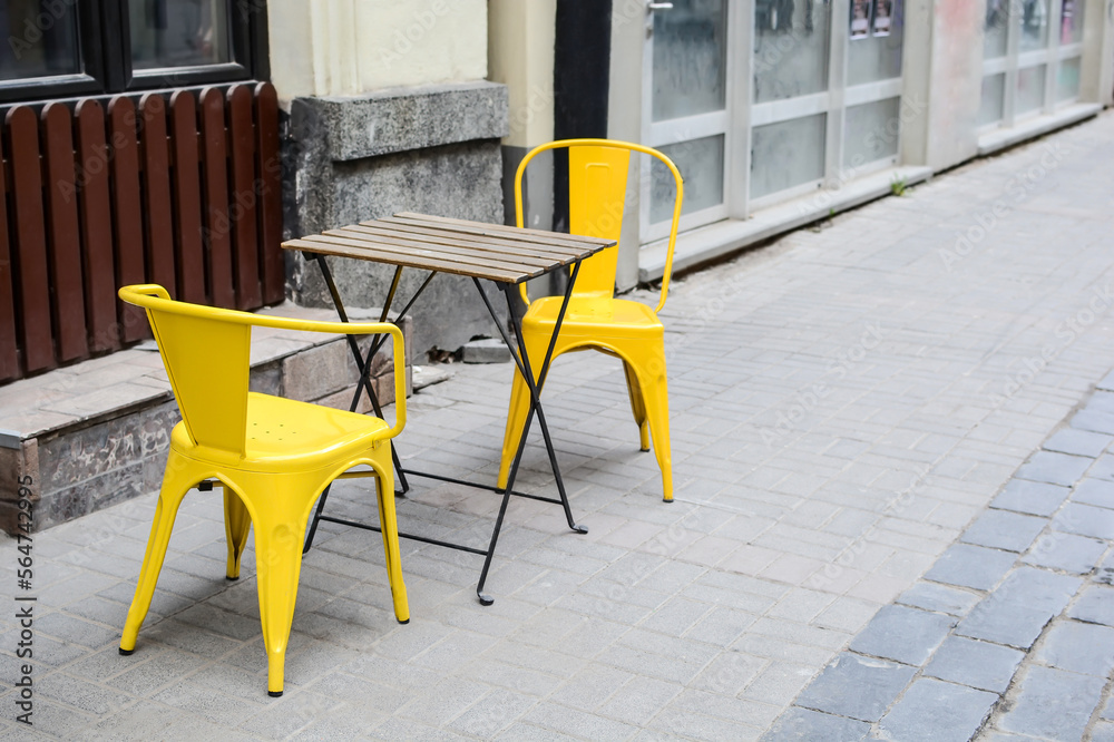 chairs and table in a cafe or summer restaurant on the street.