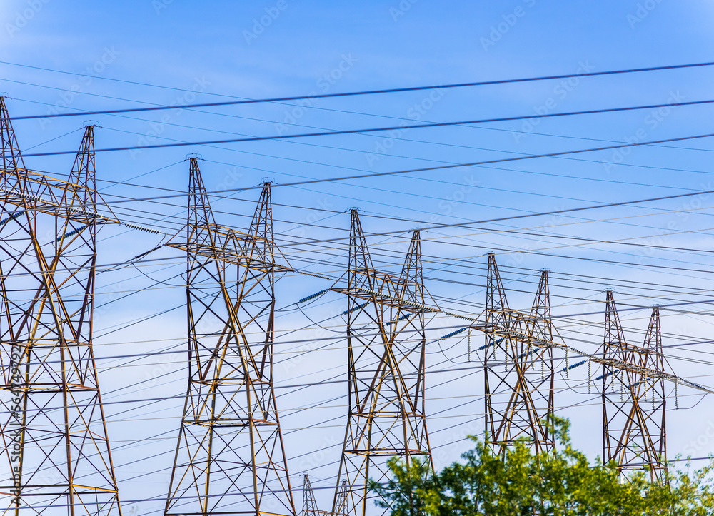 Five steel hydro towers support power cables carrying high voltage electricity from the generating plant in Niagara Falls Canada. Five steel hydro towers support power cables carrying high voltage electricity from the generating plant in Niagara Falls Canada.