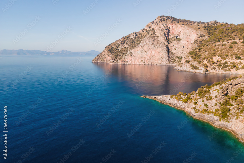 Panorama of rocky coast of Aegean sea at sunny day. Aerial view