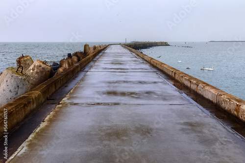 Long pier with the breakwaters on the Baltic Sea on the Vistula Spit