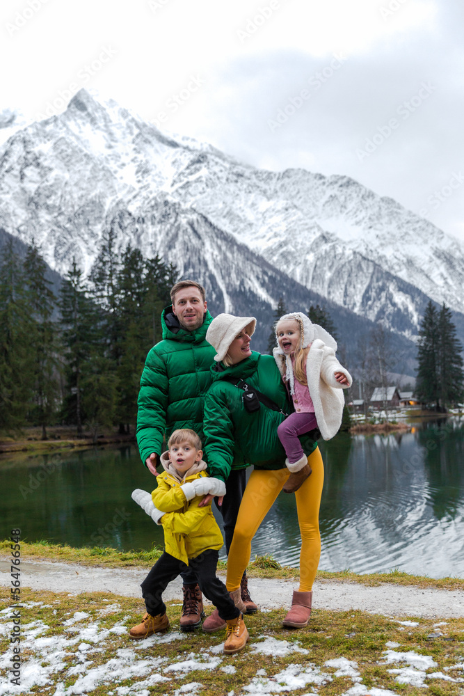 Happy Family having the holiday at Gaillands lake in Chamonix, french alps.