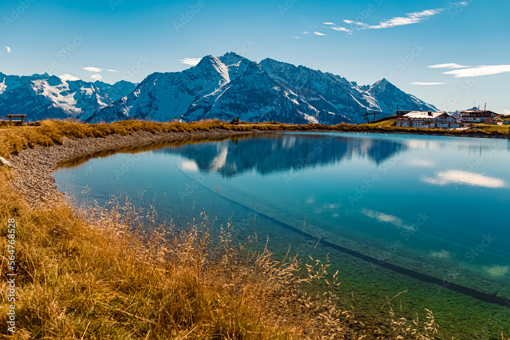 Beautiful alpine summer view with reflections in a lake at the famous Penken summit, Mayrhofen, Tyrol, Austria