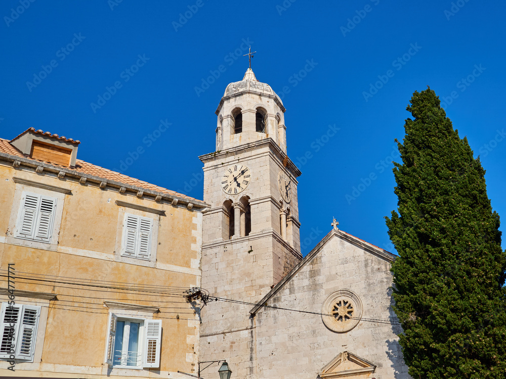 Parish church of St Nicholas in a sunny summer day with a bright blue sky. Cavtat, a village in the Dubrovnik-Neretva County of Croatia. Europe